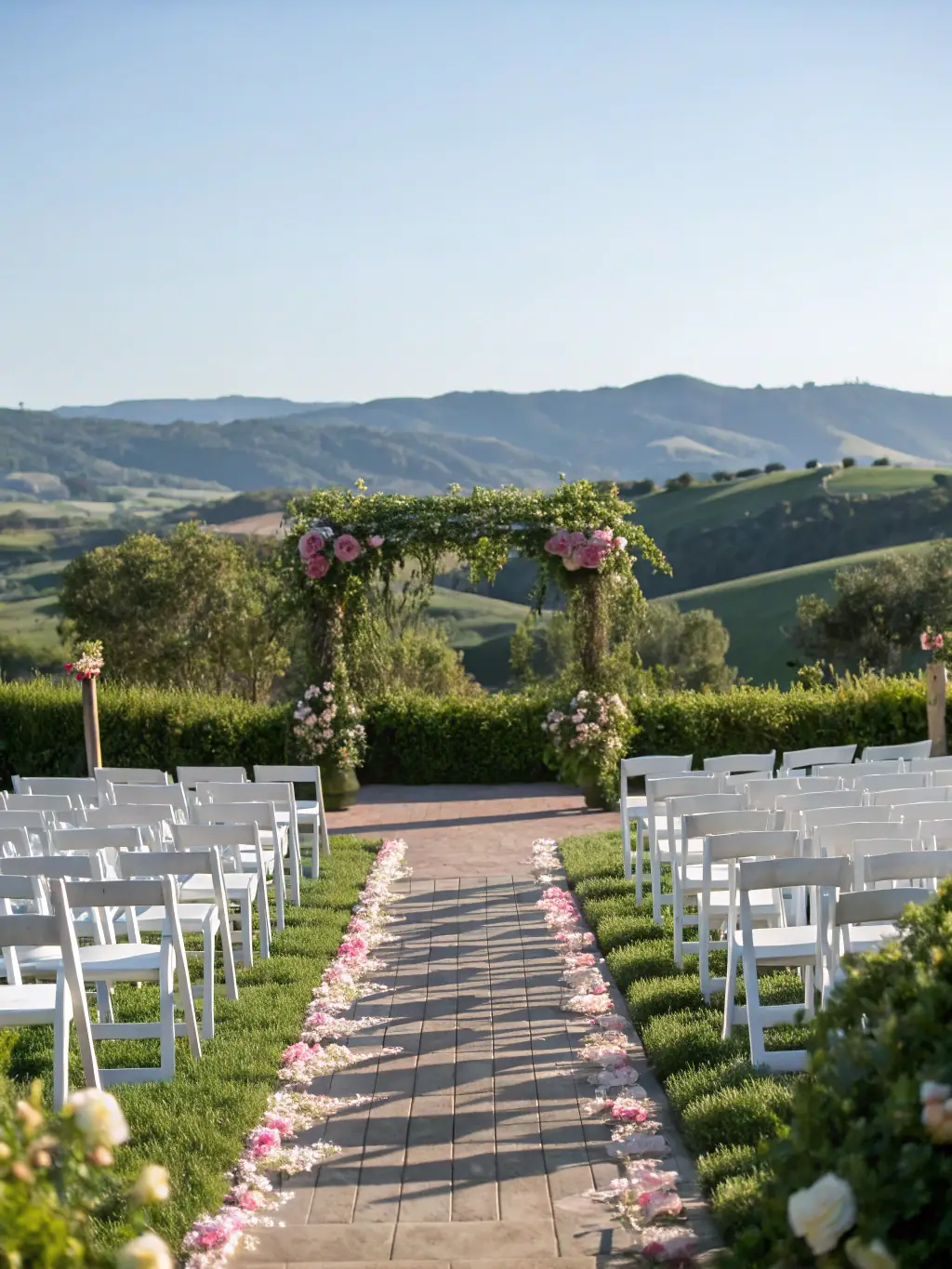 A beautifully decorated outdoor wedding venue with floral arrangements, elegant seating, and soft lighting, capturing a romantic and festive atmosphere.